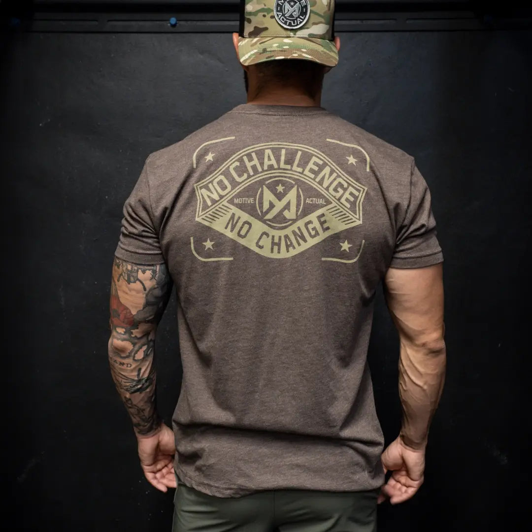 Man wearing brown Motive Actual tee Challenge.