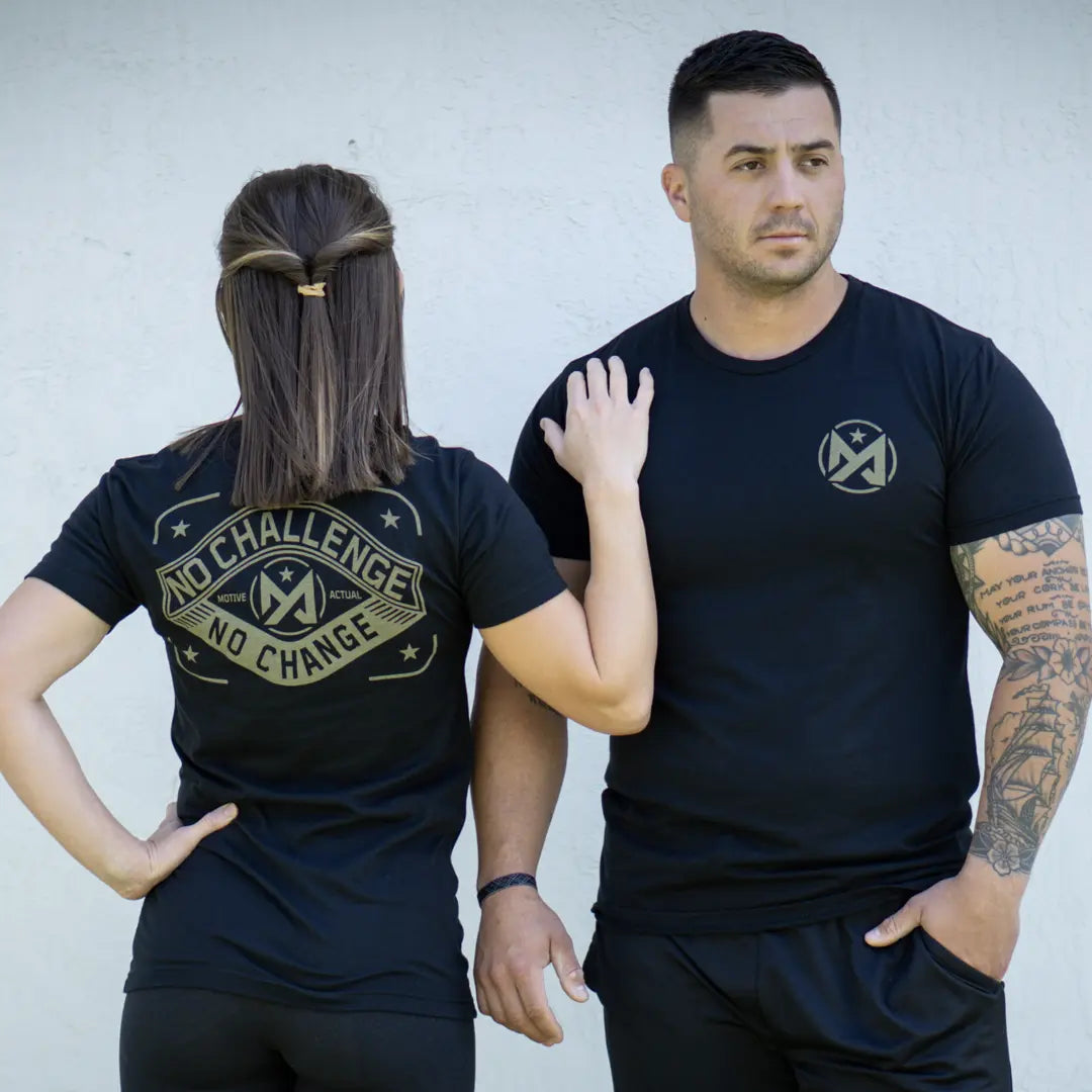 Couple wearing black Motive Actual tee Challenge.