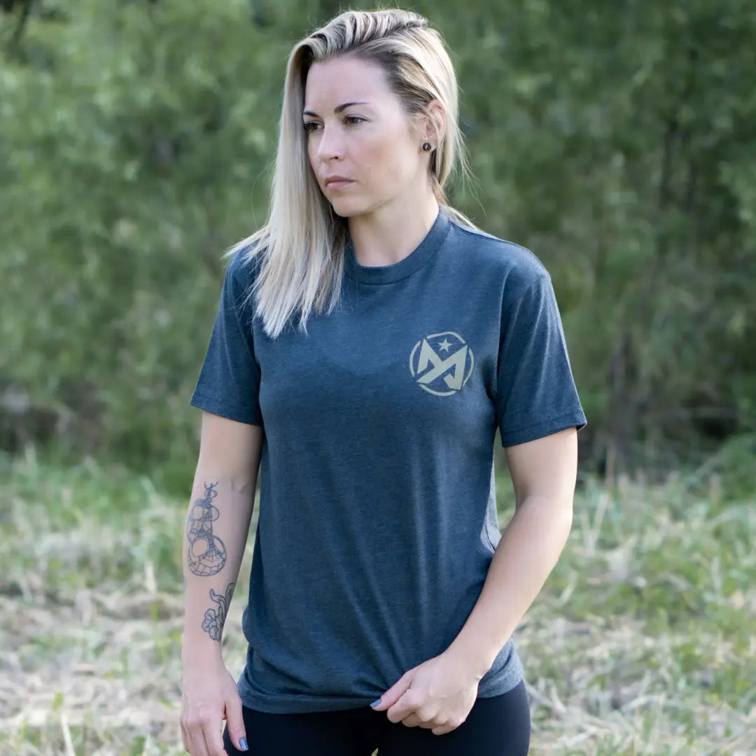 Woman wearing charcoal Motive Actual tee Challenge.